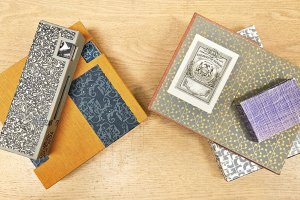 Several books adorned with decorative paper.