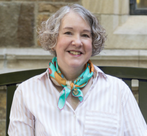 Professional headshot of Dr. Laura Lamps smiling in business attire, conveying a warm, knowledgeable, and approachable presence.