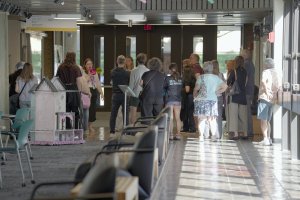A Stamps staff member leads prospective students and families on a tour of the Art &amp; Architecture Building