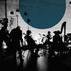Musicians gathered in a dim backstage area, playing string instruments under dramatic lighting.