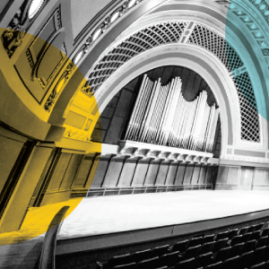 Hill Auditorium’s grand stage and ornate archways, featuring a prominent pipe organ in the center. 