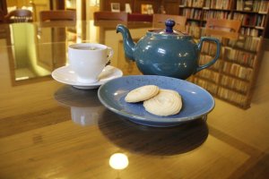 Tea service with bookcase in background