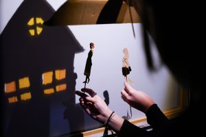 Display of puppetry with lighting.