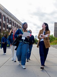 A student docent leads a walking tour.