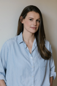 Portrait of Julie Buntin in a striped blue shirt. Photo credit, Sylvie Rosokoff