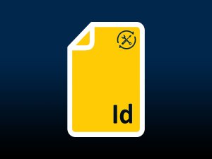 Indesign logo on a document with a wrench and screwdriver