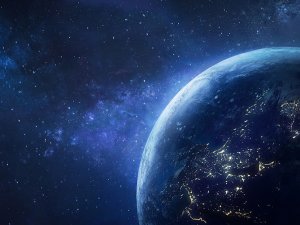 A planet in space with the light coming around the side