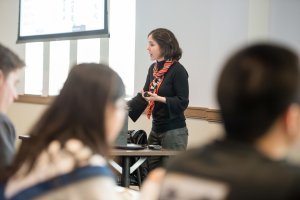 Mirando Brown teaching in front of a classroom