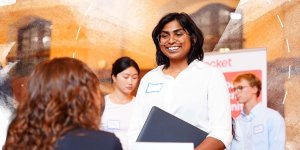 A student meeting with an employer representative.