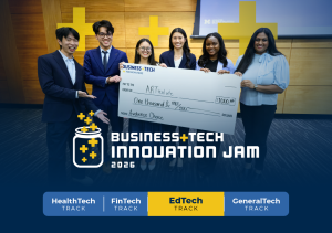 A winning team holding a check at the competition finale