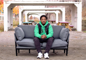 Teenager sitting on sofa