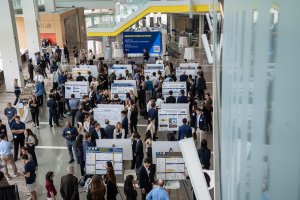 Overhead photo of people presenting poster research