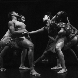 A group of four people performing an emotional dance with their gaze at one another