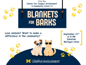 White promotional graphic for 'Blankets for Barks,' hosted by the Center for Campus Involvement and Community Cares at the University of Michigan, styled as a hanging navy blue sign. Text reads: Love animals? Want to make a difference in the community? September 21st, 6-8 PM, IdeaHub, Michigan Union. The design features illustrations of a dog and cat wearing sunglasses sitting on a navy blue dome shape, scattered yellow paw prints around the edges, and the University of Michigan Block M logo at the bottom