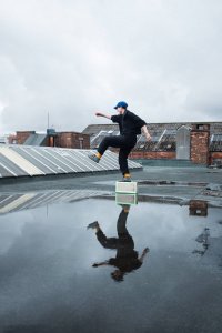 Man dancing on a rooftop