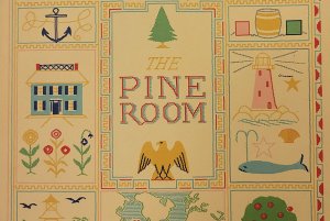 The Pine Room, with images of a home, flowers, a lighthouse, a whale, an anchor, etc.
