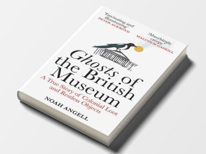 Cover of Noah Angell’s “Ghosts of the British Museum: A True Story of Colonial Loot and Restless Objects,” featuring an illustration of the museum with a bird perched on top, holding a sun disk in its mouth. Blurbs from Peter Ackroyd and Malcolm Gaskill praise the book as “fascinating and illuminating” and “absorbingly creepy.”