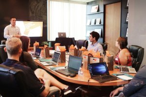 Conference room filled with people watching a presentation