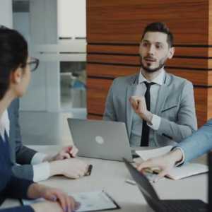 individuals talking at a business meeting