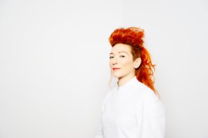 Shara Nova, woman in white with red hair