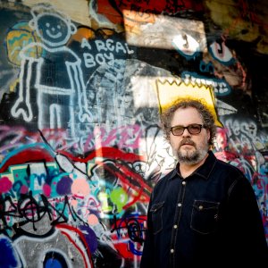 Man standing in front of a wall