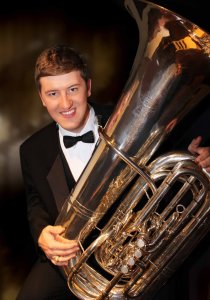 Formal portrait of Andy Smith with his tuba.