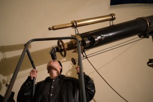 A visitor looks through the Fitz telescope