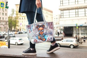 Person with decorated tote bag.