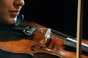 Playing the violin.