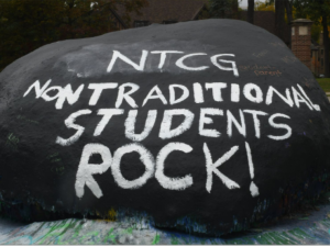 "NPTCG Non-traditional Students Rock!" painted on a Rock at the University of Michigan