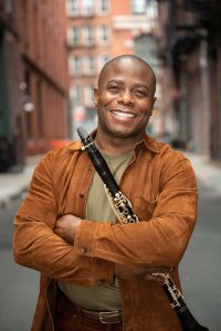 Man smiling with clarinet