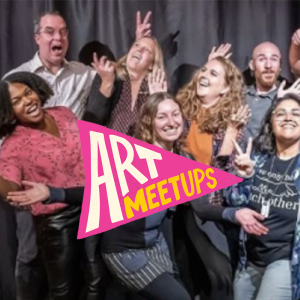 A group of performers smile at the camera, a pink flag that says "Art Meetups" is overlayed on the image