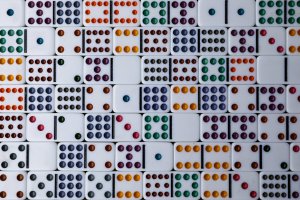 Dominoes laid out in a background pattern.