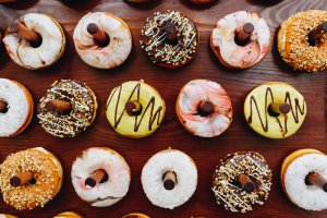 Delicious sweet donuts or doughtnuts on a special stand at a party or event, dessert, desserts, sugar, treat, sweets