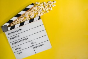 Clapperboard with popcorn