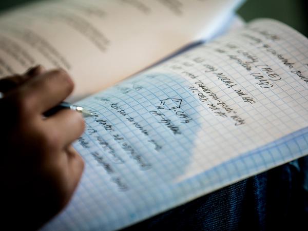 writing in notebook