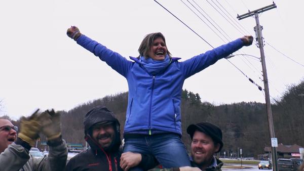 Sandra Steingraber is hoisted up on the shoulders of those celebrating the NY state fracking ban. Image credit: Heriberto Rodriguez
