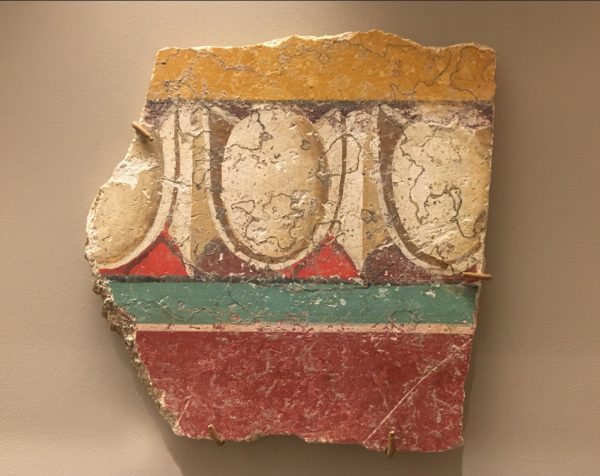 A fragment of a fresco (a type of wall painting) found in the ancient Roman city of Pompeii. Delicately painted, this painting shows a design called egg and dart. Oval egg shapes are interspered with vertical lines and painted to give the painting a sense of depth even though it is flat. Brightly colored bands decorate the fragment, which is about the size of an adult's hand, above and below the egg and dart pattern.
