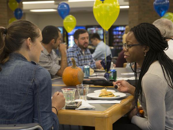 People talking and eating