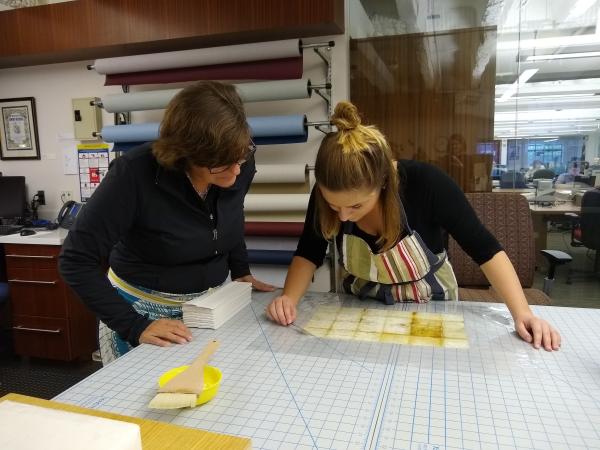 Clements Conservator and Student Intern Working Together