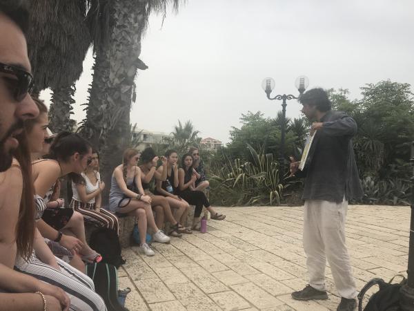 Professor teaching students abroad