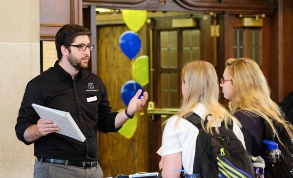 Manager highlighting housing for students
