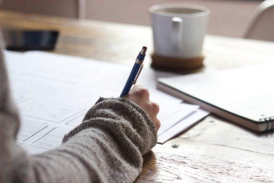 Image of a person writing