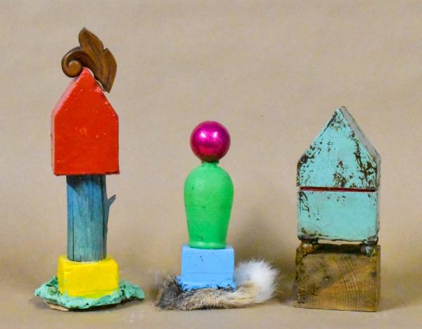 Two House Totems surrounding small Totem by Candace Compton Pappas, photograph by the artist.
