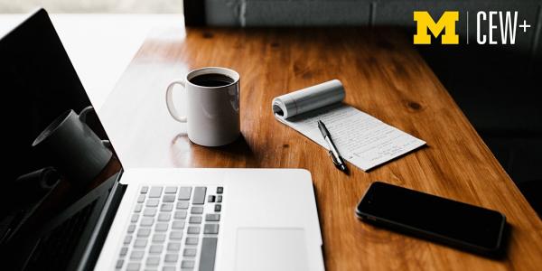 Laptop, coffee, notepad and phone