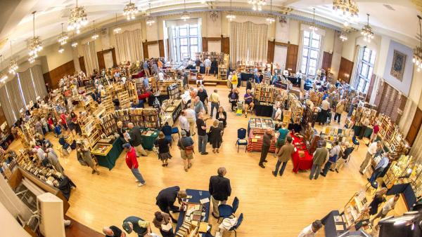 Dealers and shoppers fill the Michigan Union ballroom during a past book fair.