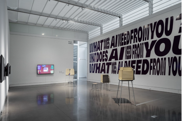 Black text on the gallery/museum wall