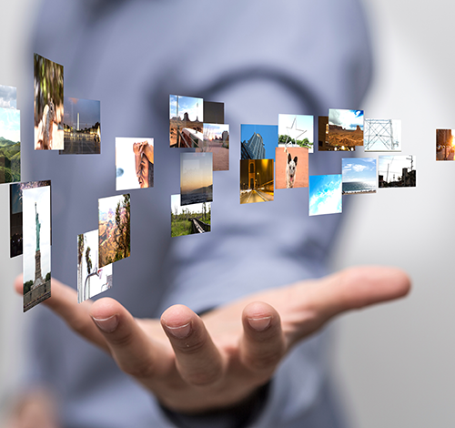 image of photos floating over a person's hand