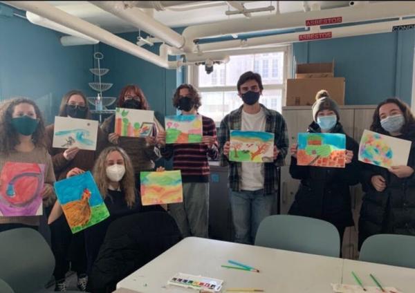 Students engaged in a watercolor painting activity
