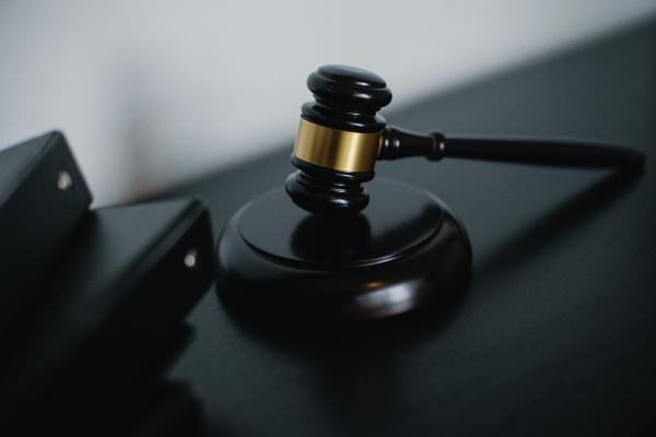 Photo of a gavel against a dark background. Image by Sora Shimazaki on Pexels